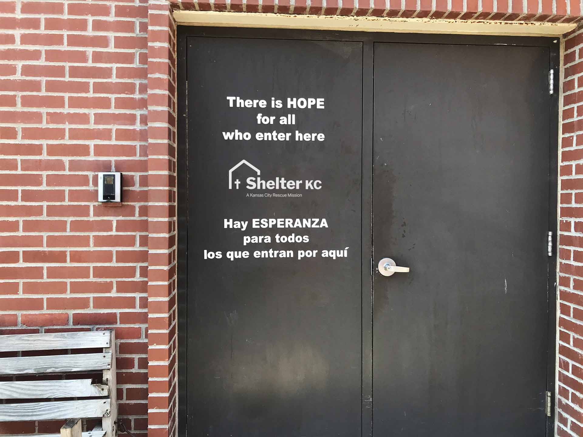 "There is HOPE for all who enter here" sign on the Shelter KC door