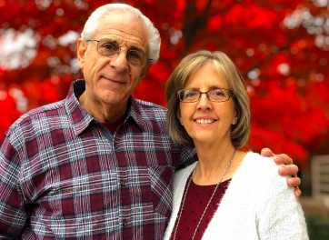 Joe and wife smile for headshot