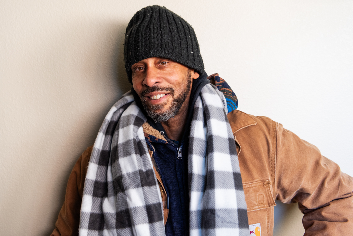 man in coat and scarf