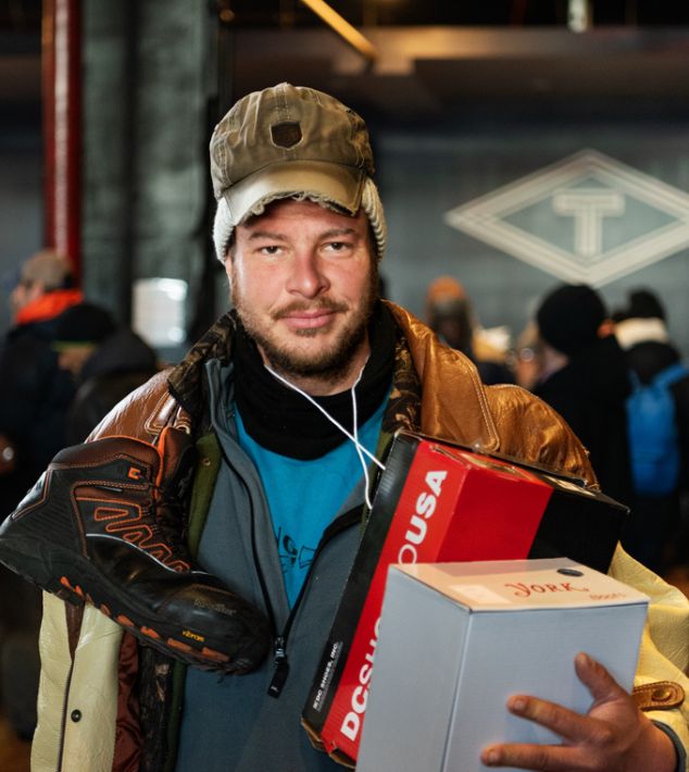 man holding shoe box
